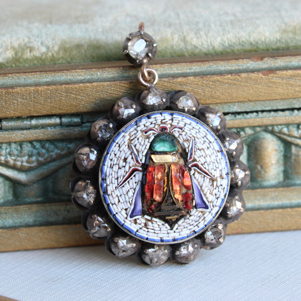 micro mosaic beetle set in a rose cut diamond halo frame as a pendant