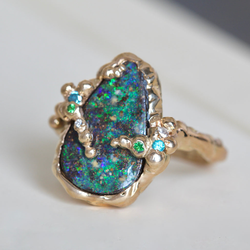 Handmade green and blue boulder opal ring hammered branch style gold design with tsavorite and blue diamond accents