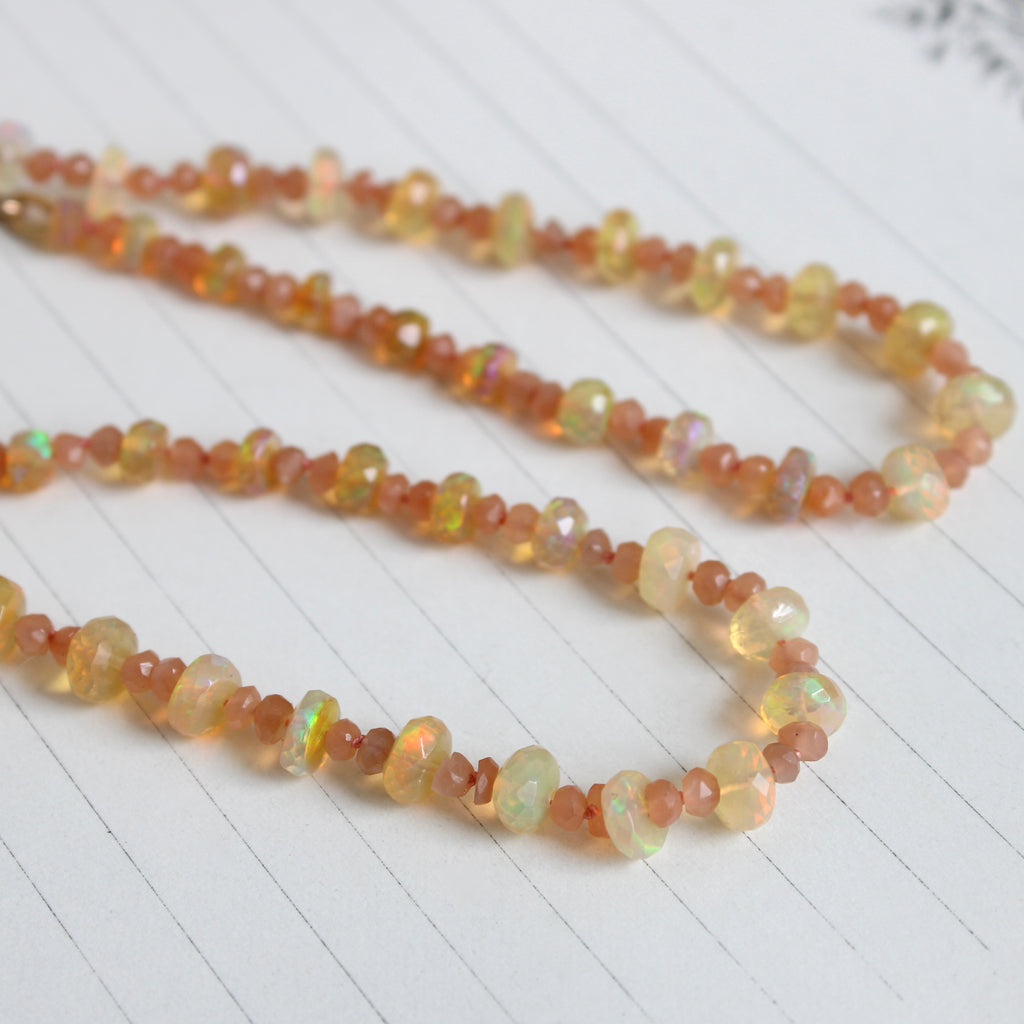 peach sapphire beads hand knotted on peach silk with ethiopian opal rondelles