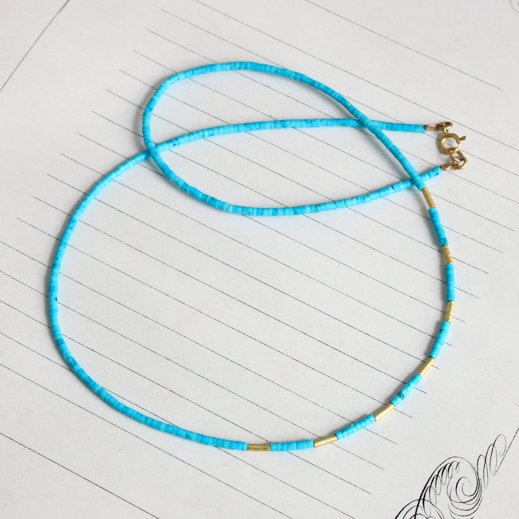 bright blue turquoise bead necklace with high karat hammered gold tube spacer beads