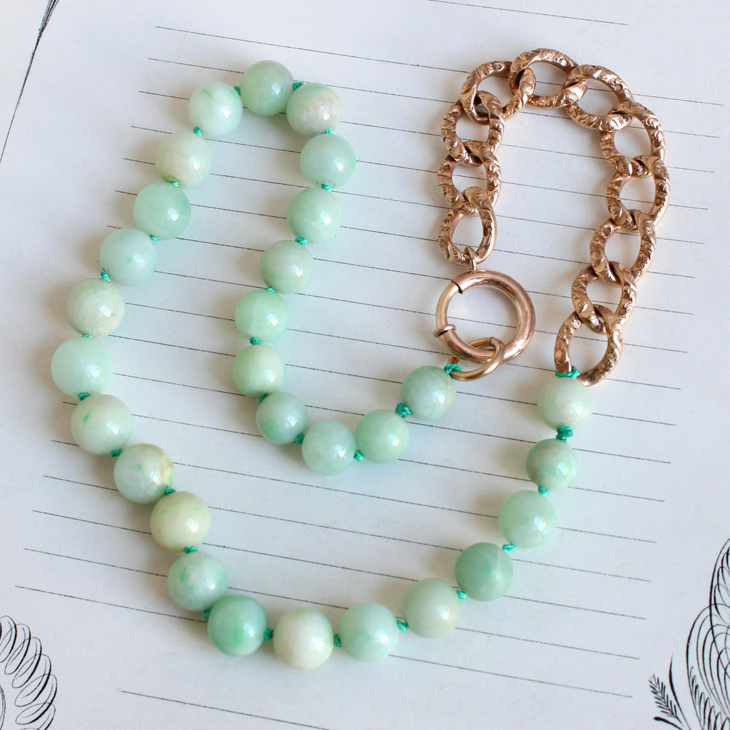 light green jade beads mixed with embossed curb chain as a necklace