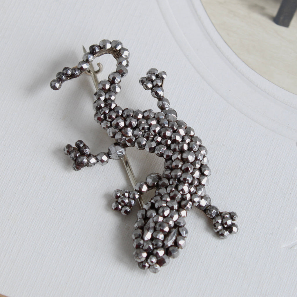 salamander lizard brooch made of very sparkly hand-cut steel rivets on a metal backing