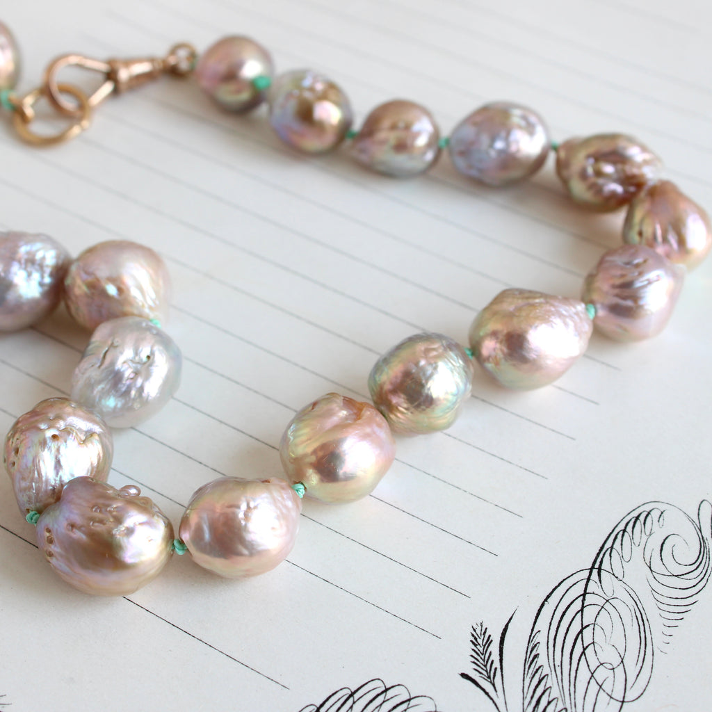 large freshwater pearls with iridescent sheen and irregular shape