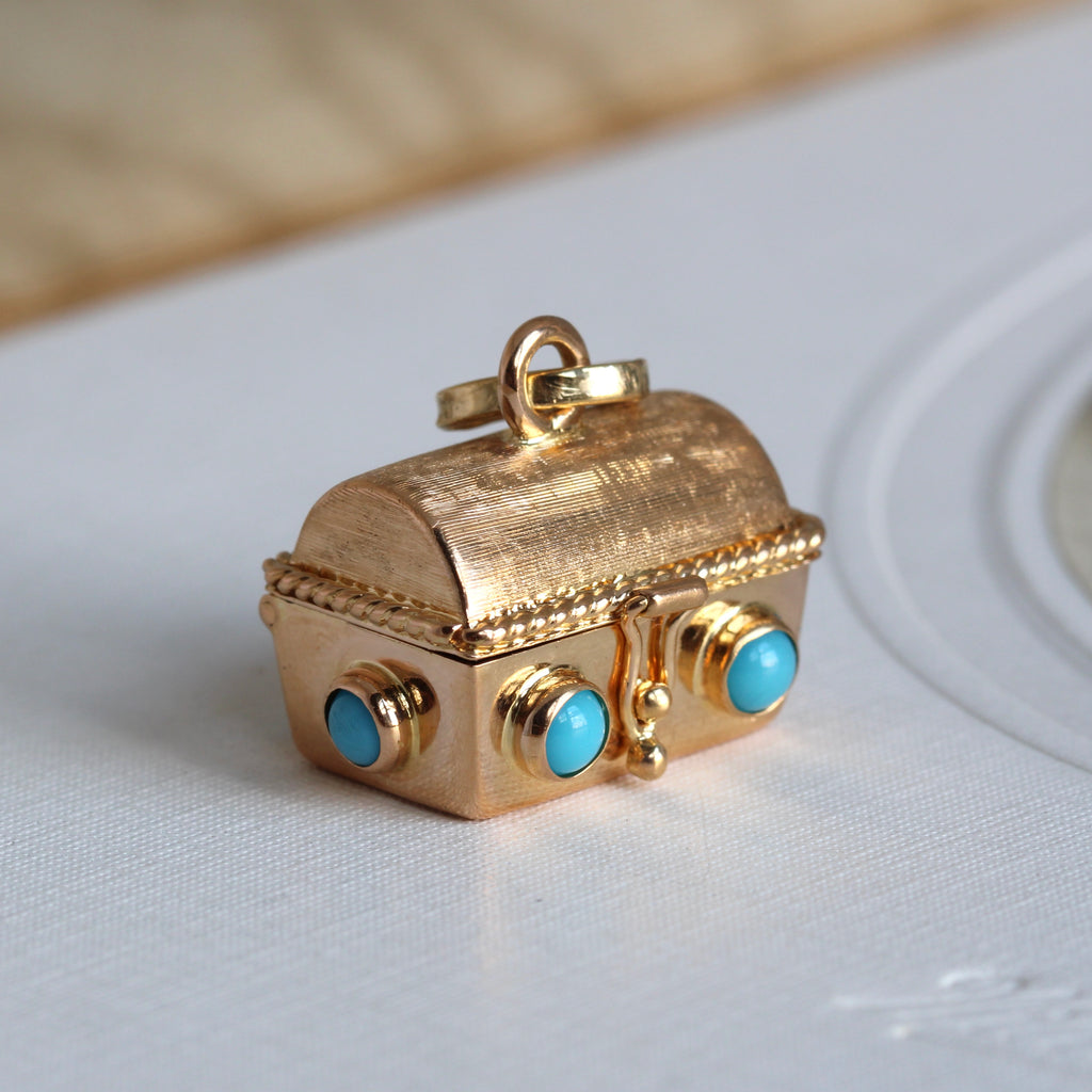yellow gold miniature treasure chest pill box studded with turquoise cabochons