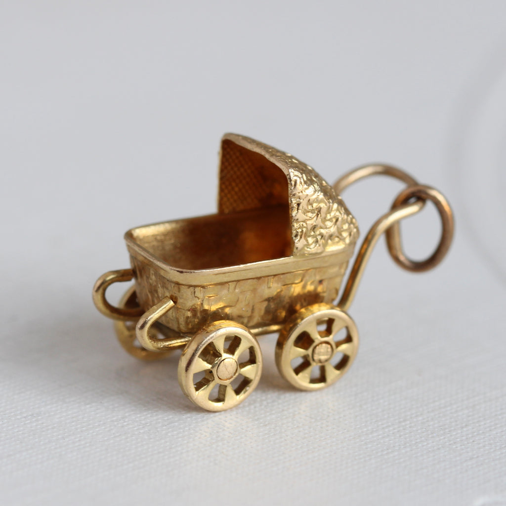 vintage yellow gold miniature baby carriage charm