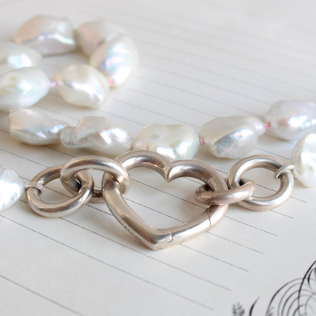 white baroque pearls on rainbow silk with heart shaped sterling carabiner clasp