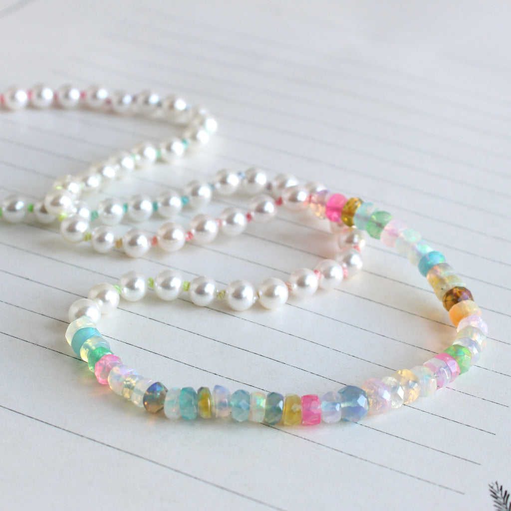 small white pearls knotted on rainbow silk with a front section of bright multi-color opal beads