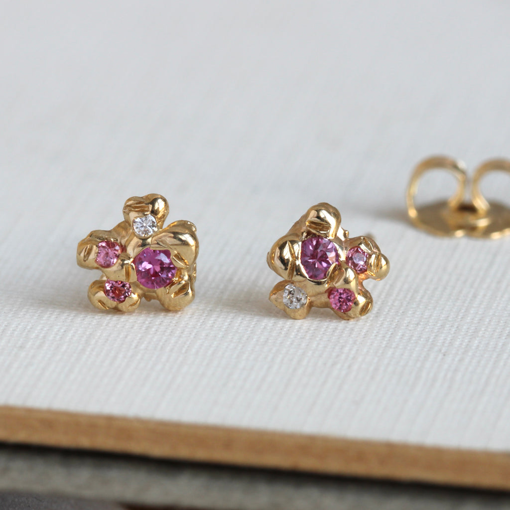 yellow gold stud earrings in a organic bubble style with pink spinel and white diamonds