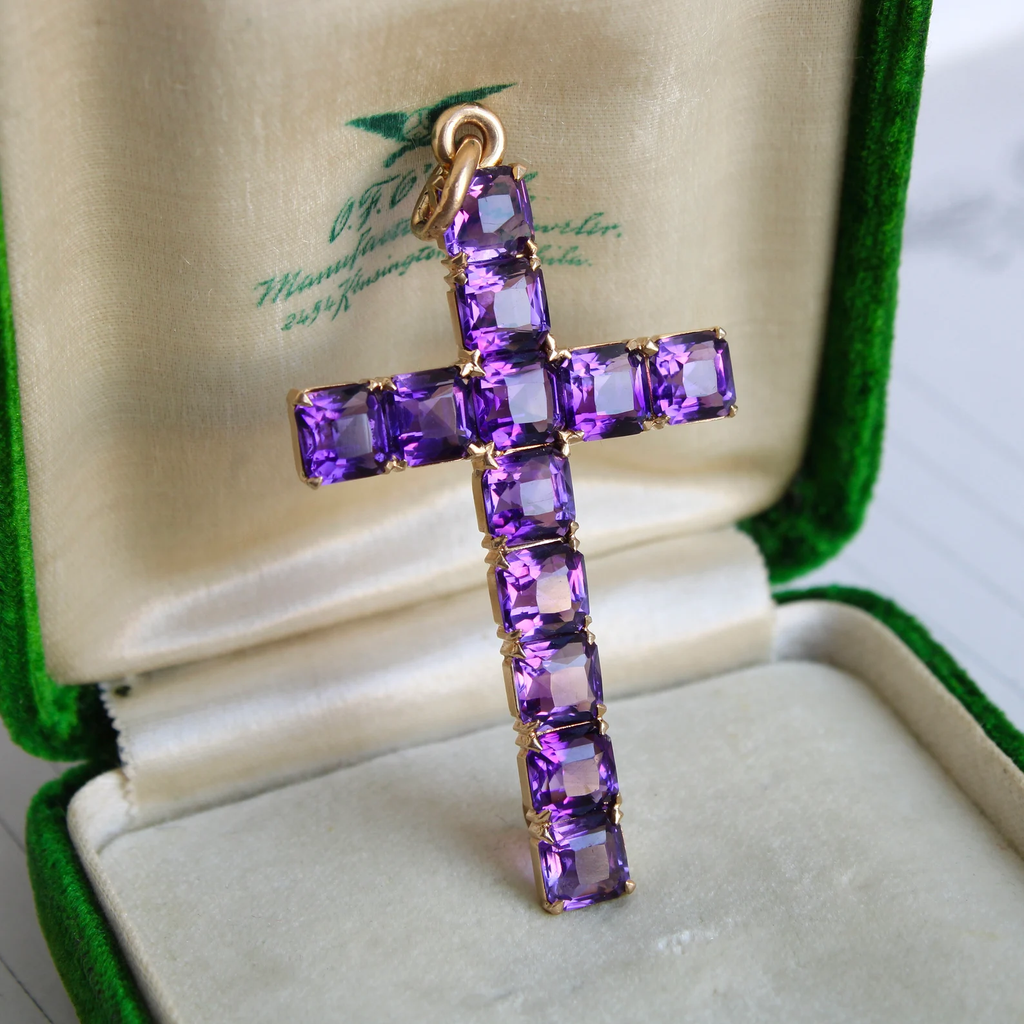 Antique yellow gold cross set with faceted purple amethysts.  