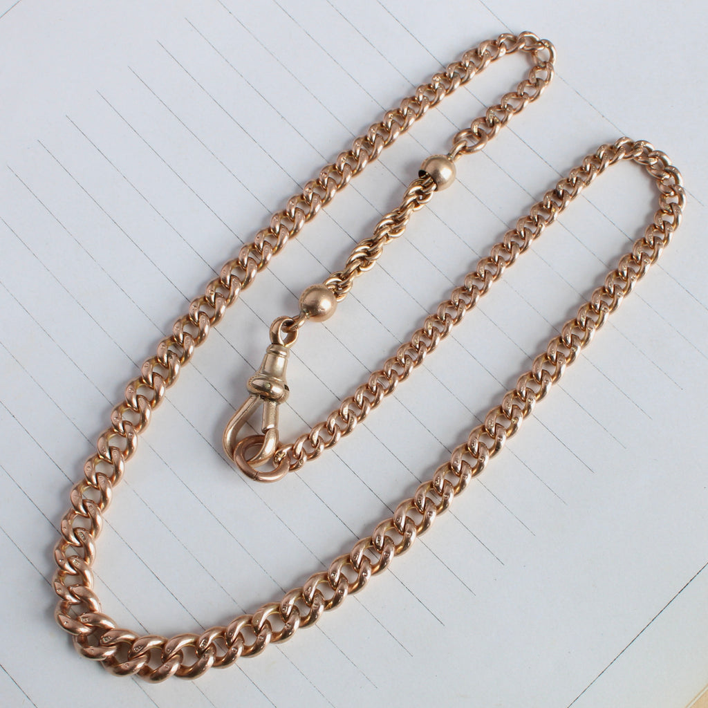 rose gold chain necklace with graduated curb links and a rope chain extension, clip clasp that can hold charms