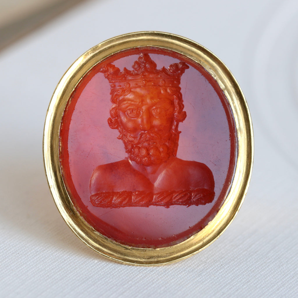 yellow gold ring with carnelian carved with a bearded man wearing a crown, crest from the arms of the Earl of Lindsey