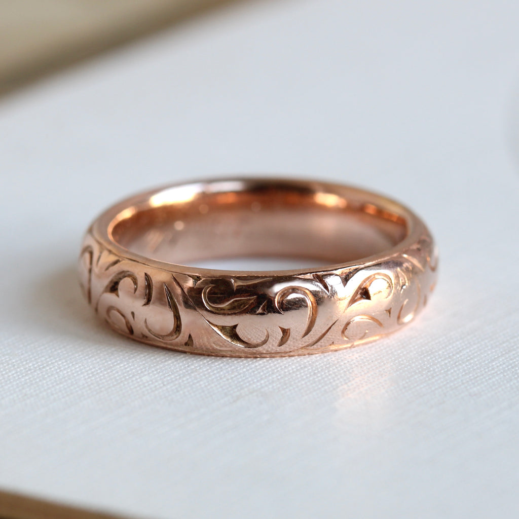 rose gold band with donut or dome profile and scroll pattern engraving all around