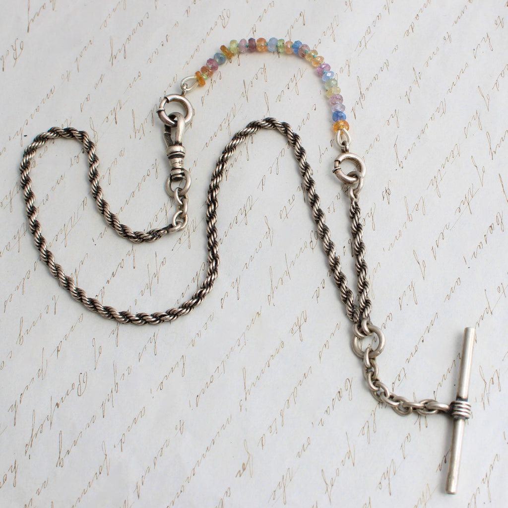 antique silver rope chain with a t-bar and dog clip clasp extended in length with multi color sapphire beads