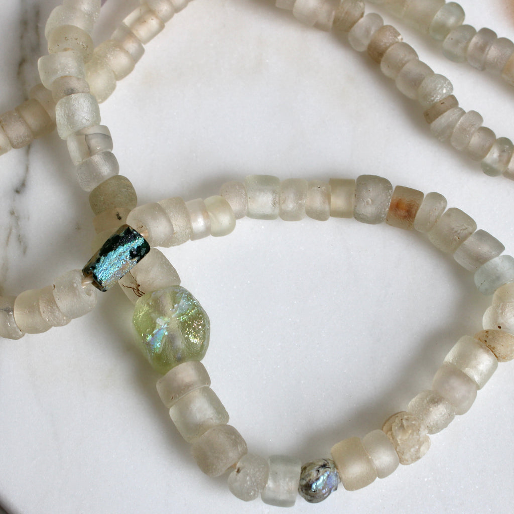 necklace of ancient roman glass beads and frosty white trade beads from the 17th century