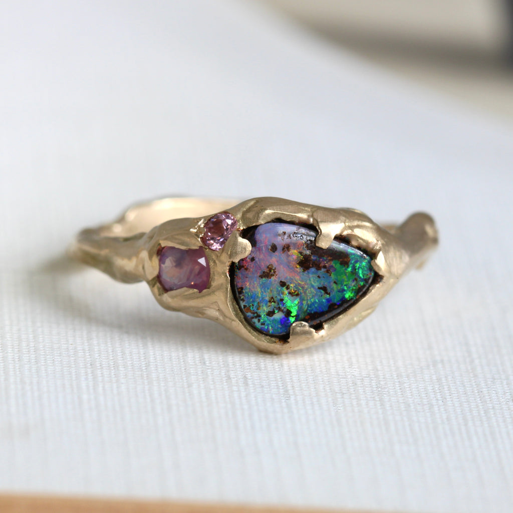 yellow gold organic branch design ring with tear drop boulder opal and pink sapphire and spinel accents