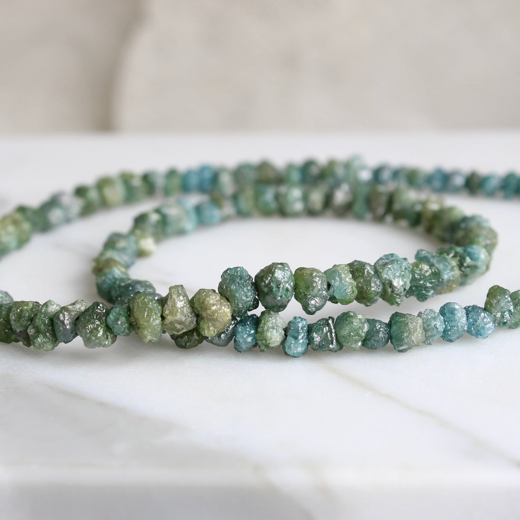 rough diamond bead necklace in a range of blue to green color