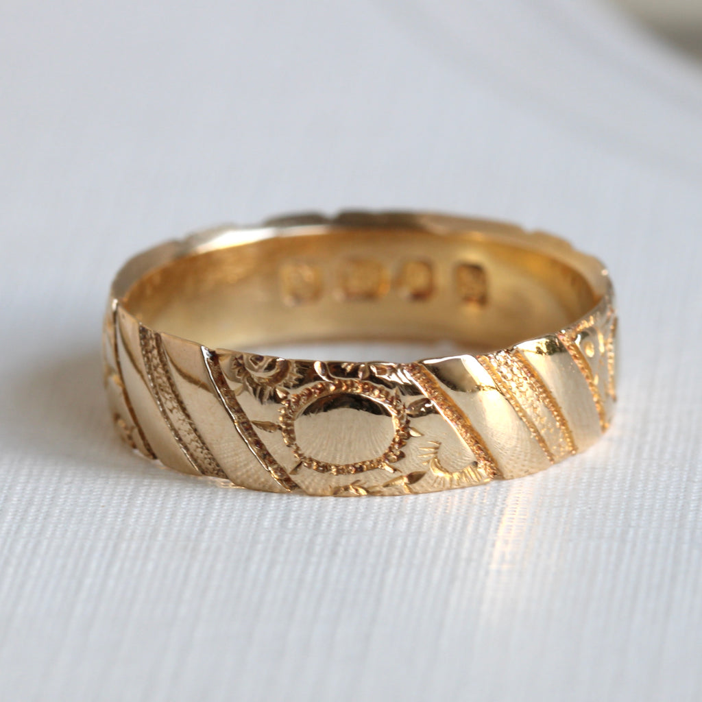 deep yellow 18k band engraved with a slanted stripe and flower pattern, letter dated 1893