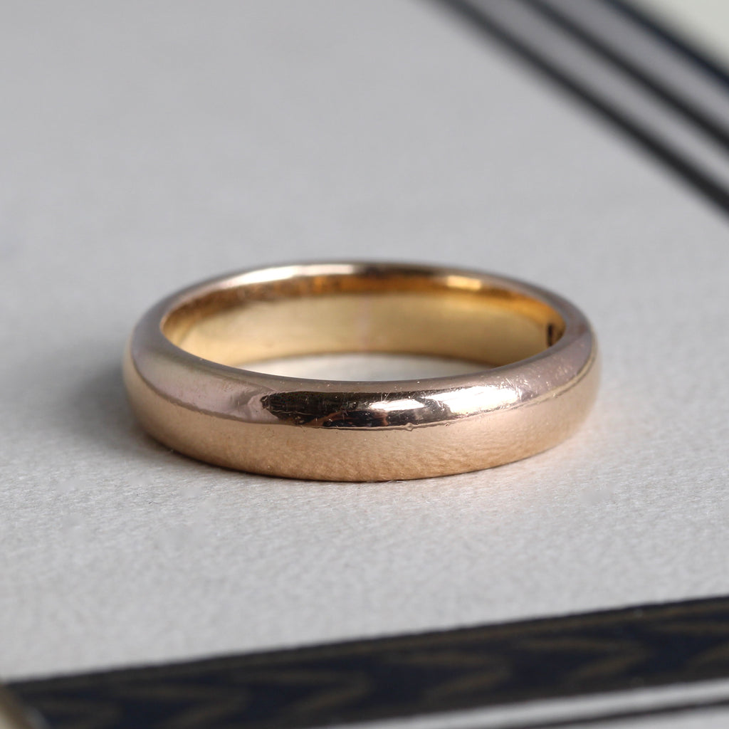 antique 22k rosy yellow gold band with rounded profile edges and english hallmarks inside