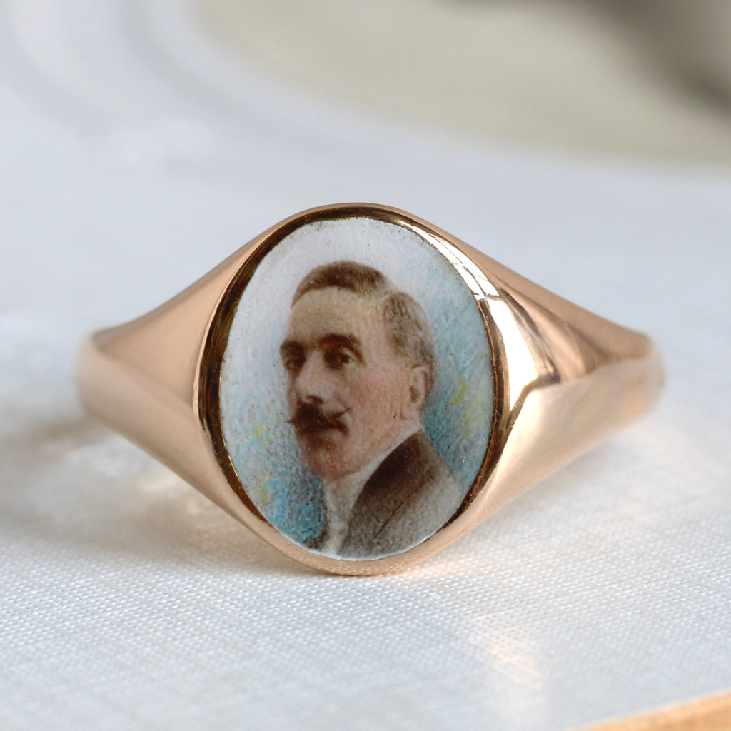 photographic style enamel portrait of a man with a mustache on an 18k yellow gold signet ring