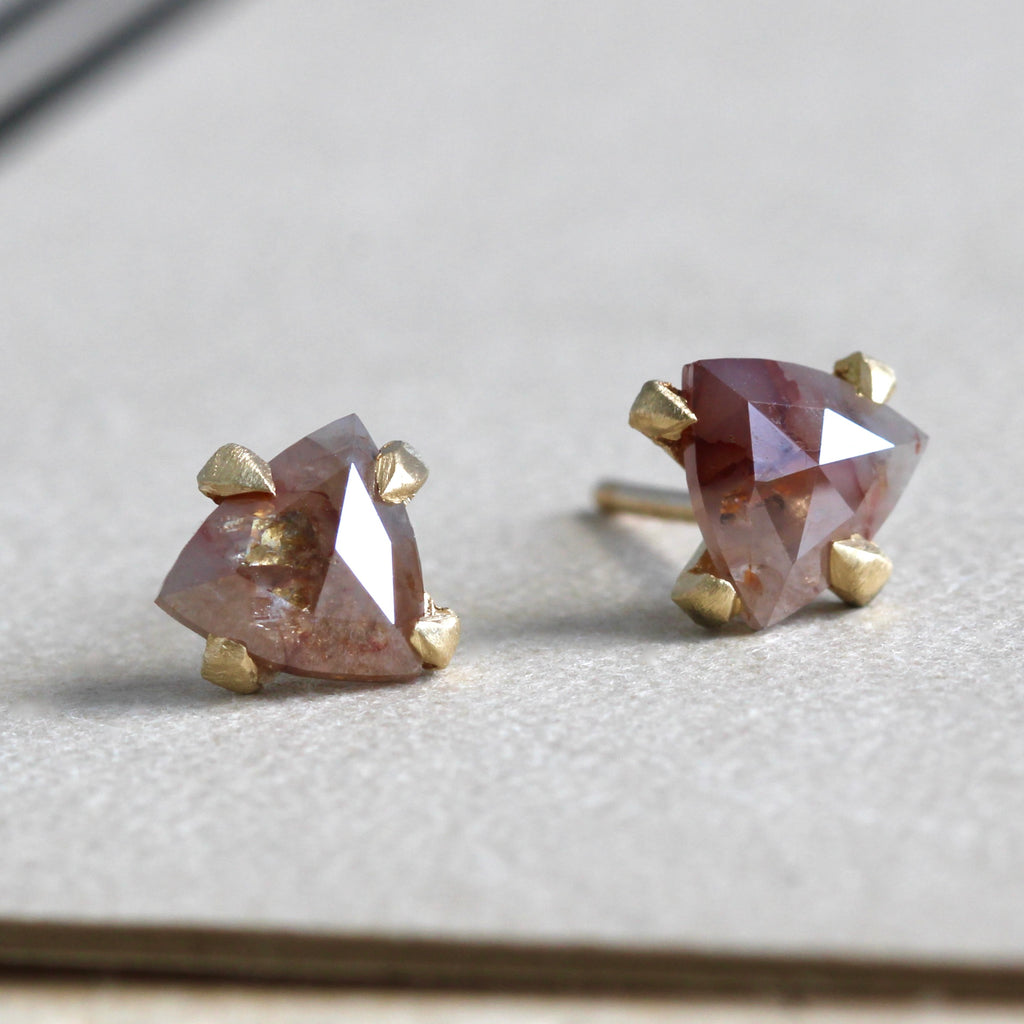 triangle shaped cinnamon colored rose cut diamonds set as stud earrings