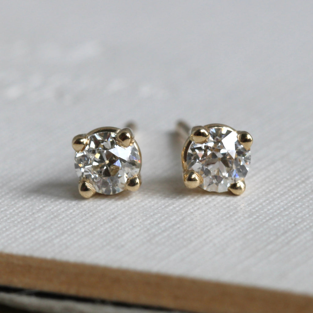 .32 ctw old mine cut diamonds set in 14k 4-prong yellow gold stud mountings