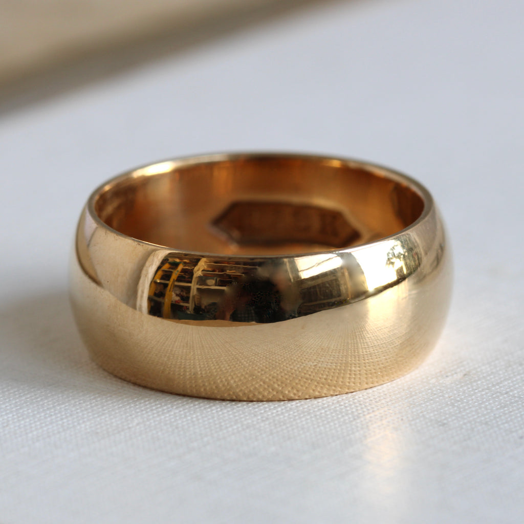 wide antique yellow gold band with high dome profile