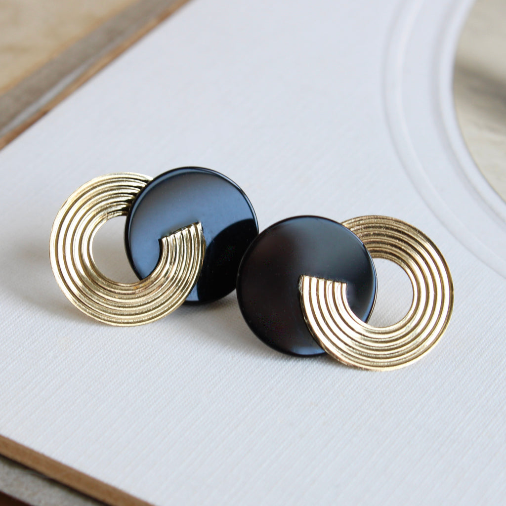 earrings with black onyx circles overlapping yellow gold circles