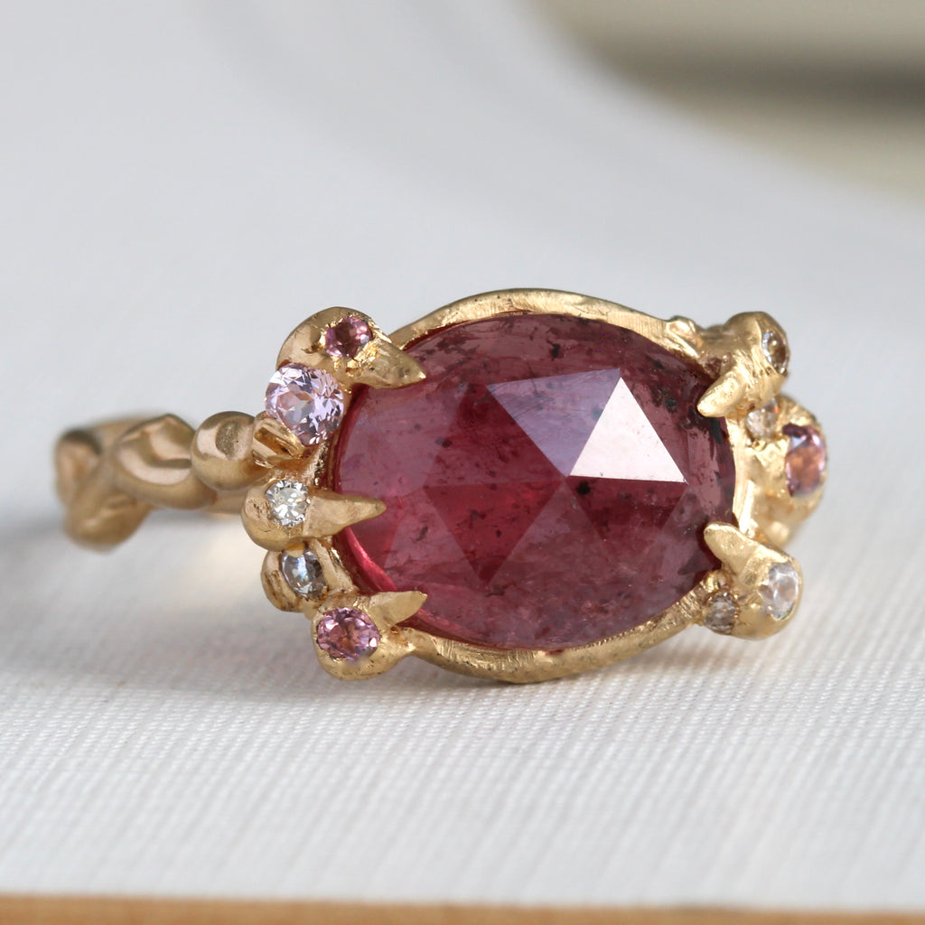 handmade 18k branch style ring with rose cut ruby in assymetrical prongs and pink spinel, diamond and pink sapphire accents