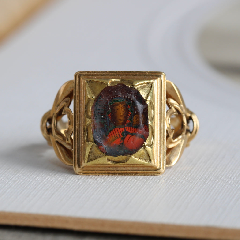 high karat gold ring with hand-painted miniature portrait of madonna and child under glass, done in a gothic revival style with open work arabesque shoulders