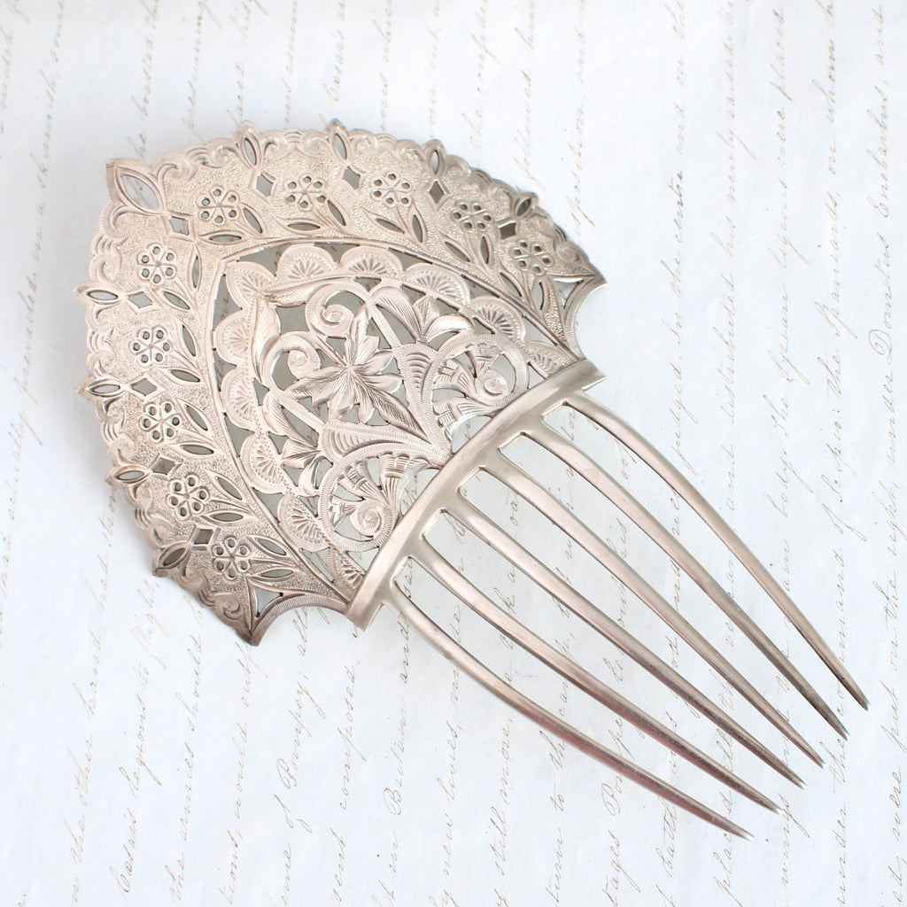 antique sterling hair comb with high crown top completely hand-engraved with flower design and three prongs