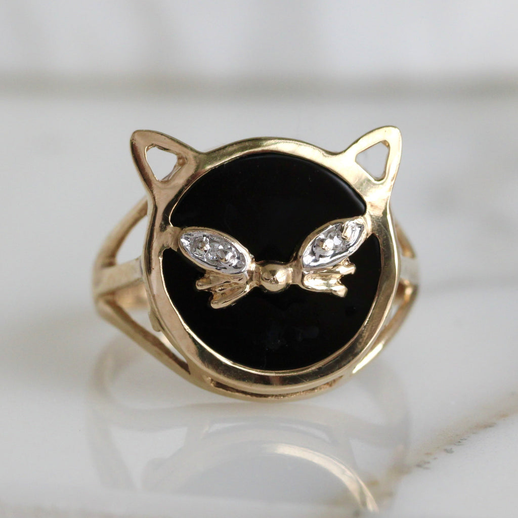 Gold cat face ring with black center and diamond  eyes