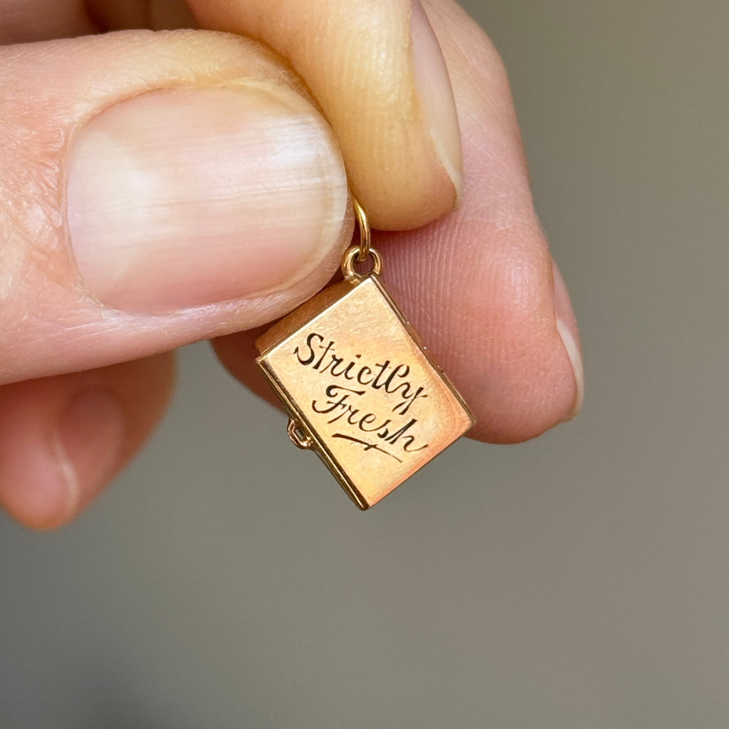 yellow gold box charm that holds six pearls