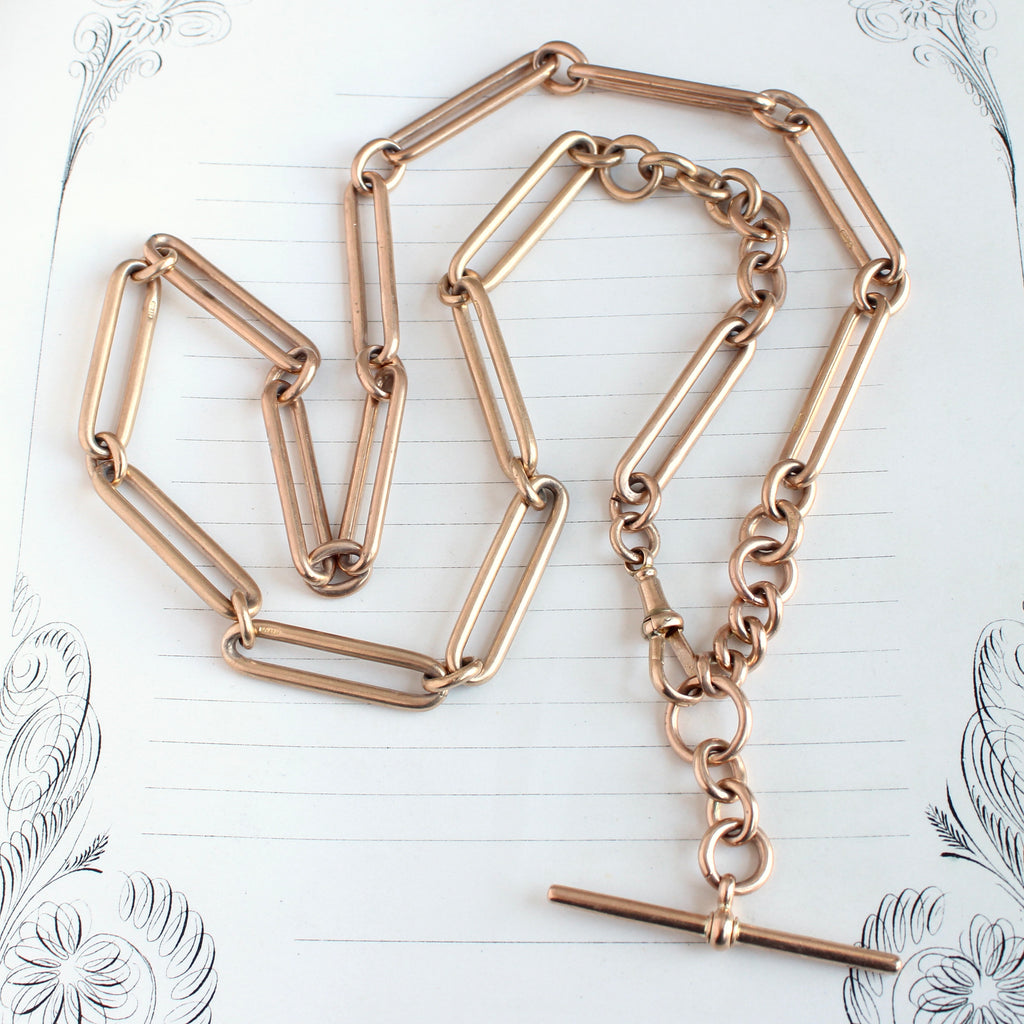 heavy rose gold watch chain necklace with trombone links and dog clip clasp and t-bar at one end