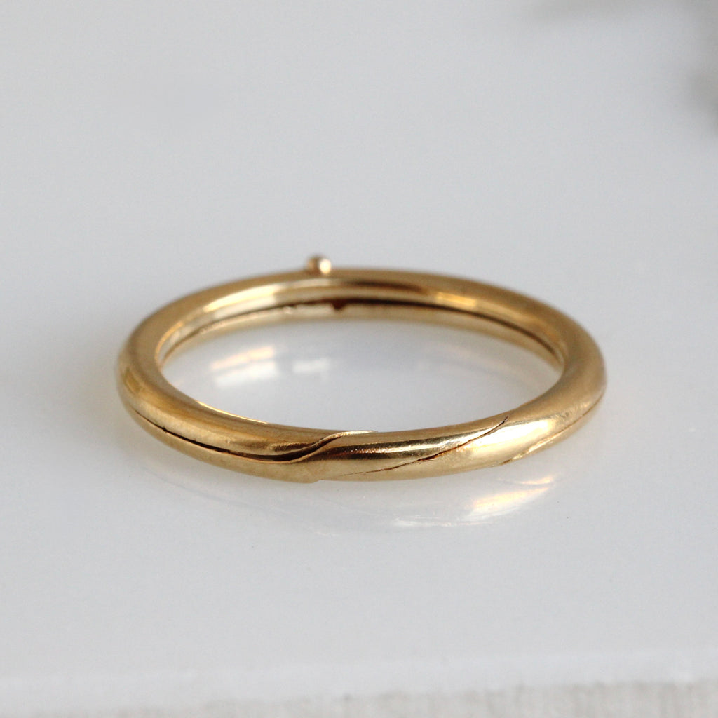 yellow gold band that splits in two 