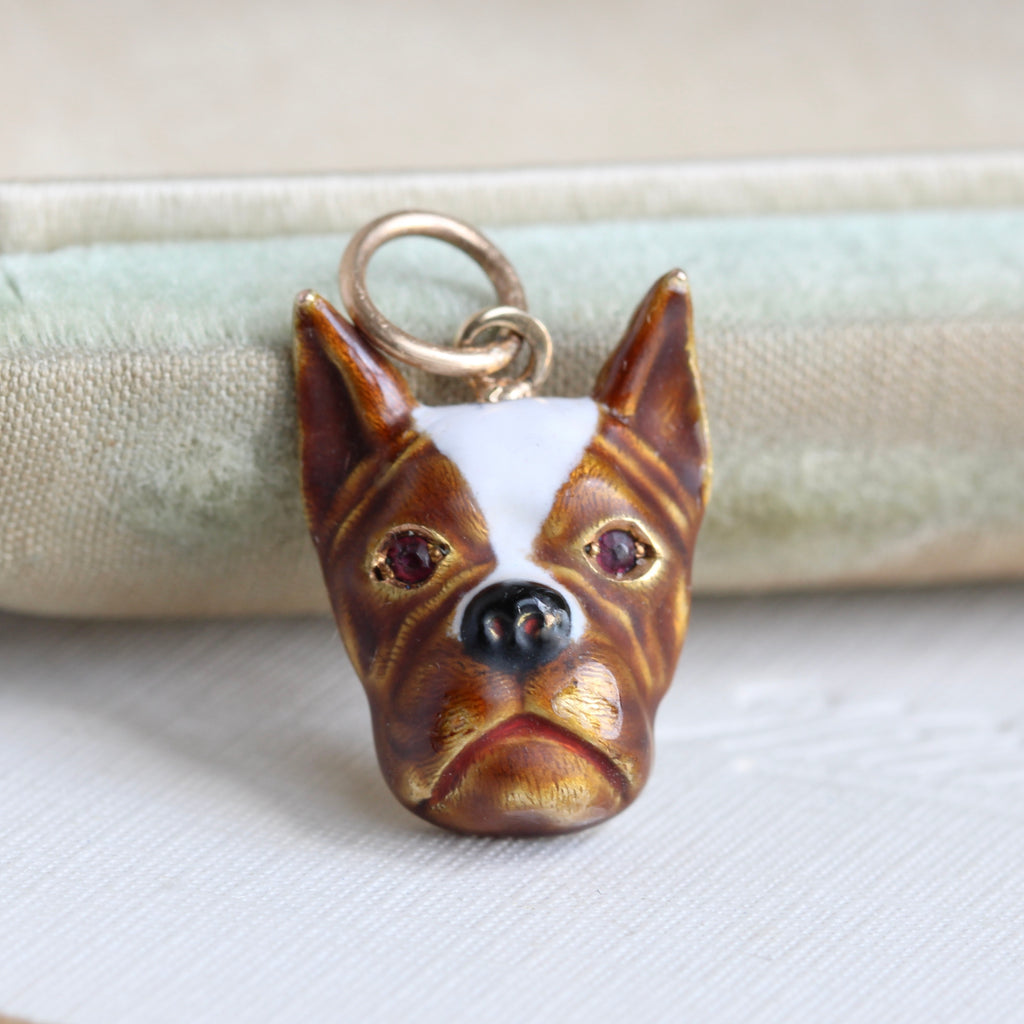 gold charm enameled to look lika a boxer dog