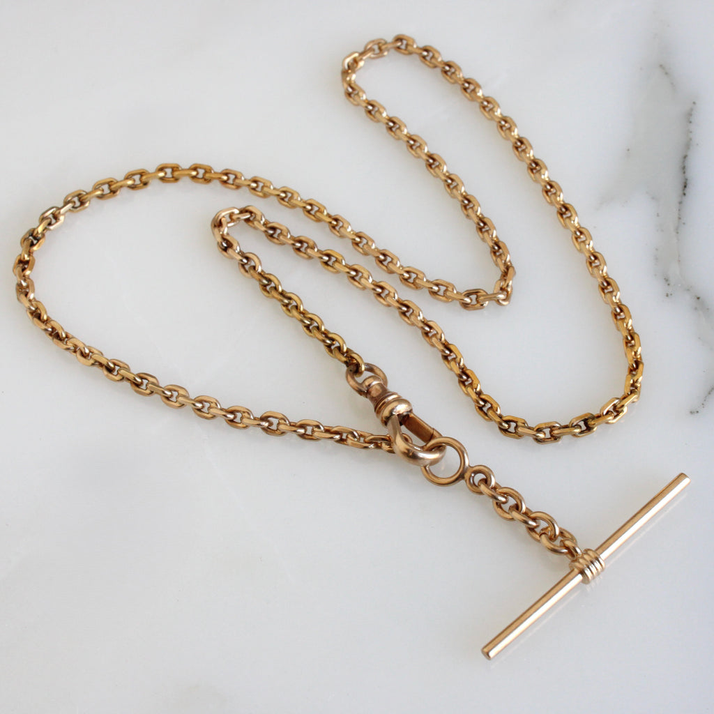 gold chain necklace with a t-bar shaped toggle pendant 