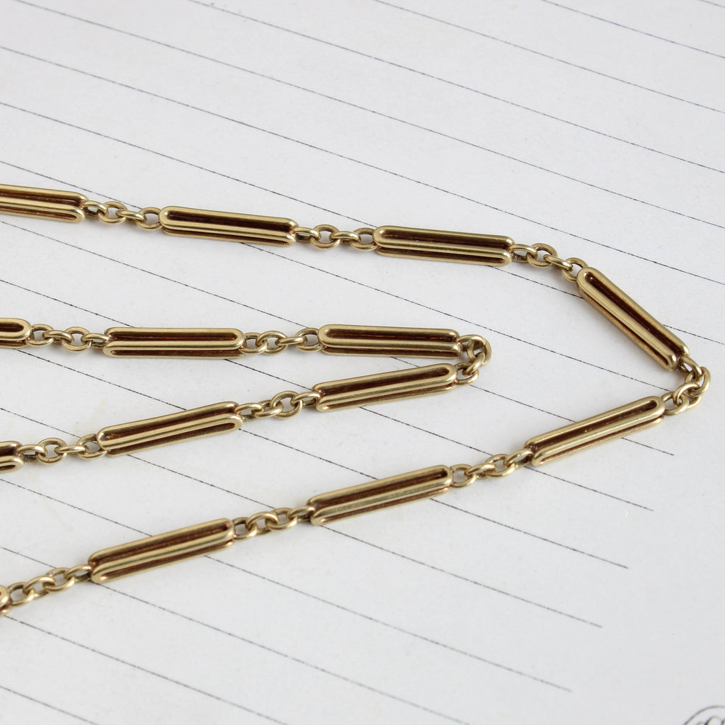 bright yellow gold chain with alternating cable and paperclip link sections