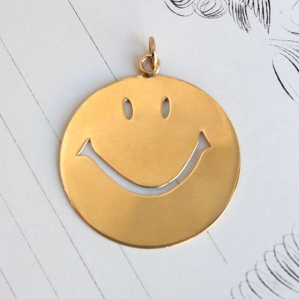 large yellow gold smiley face pendant