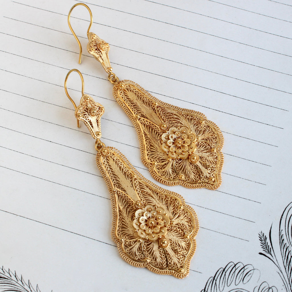 long yellow gold filigree earrings with a floral motif
