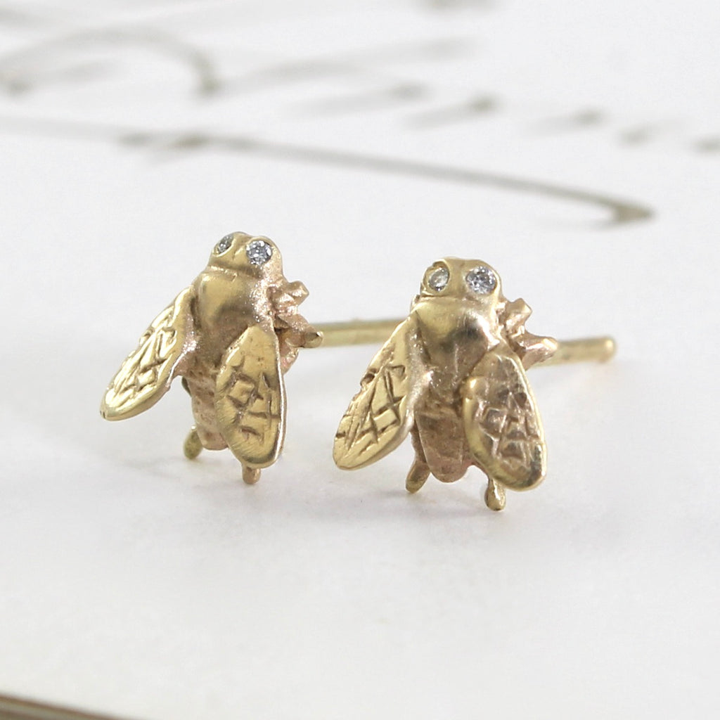 miniature housefly stud earrings in yellow gold with diamond eyes