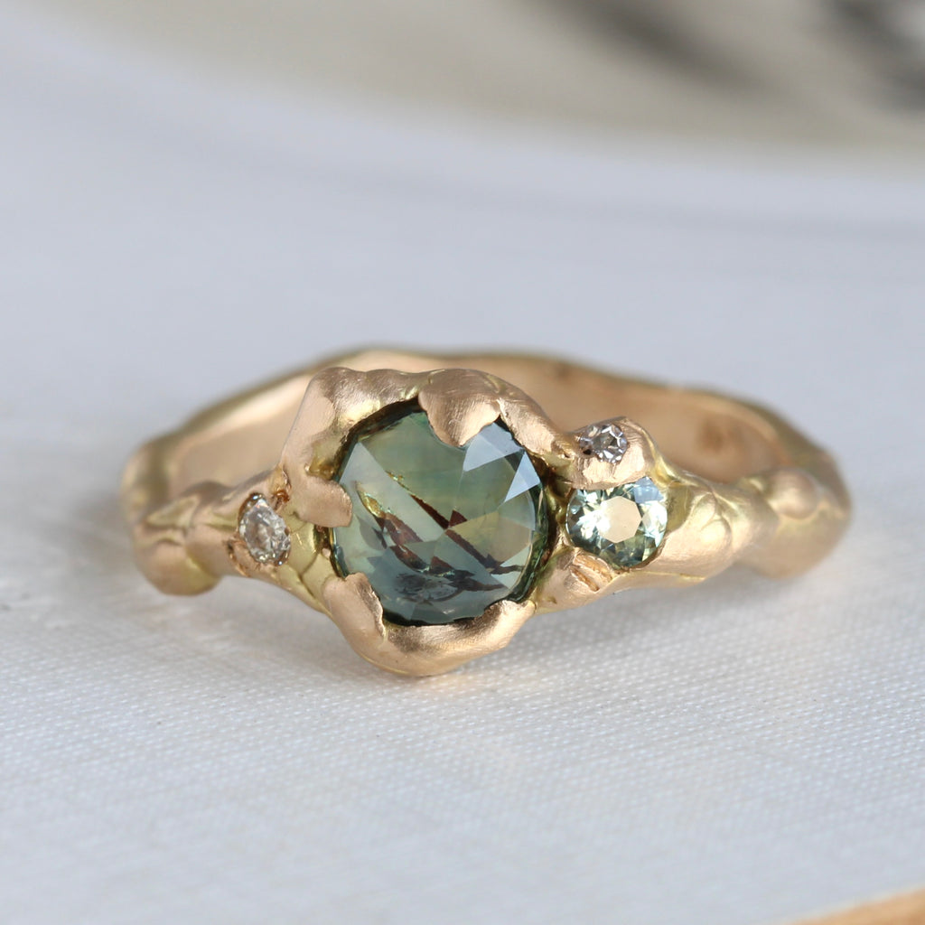 yellow gold branch style ring set with mixed color green and blue rose cut sapphire with green sapphire and diamond accents