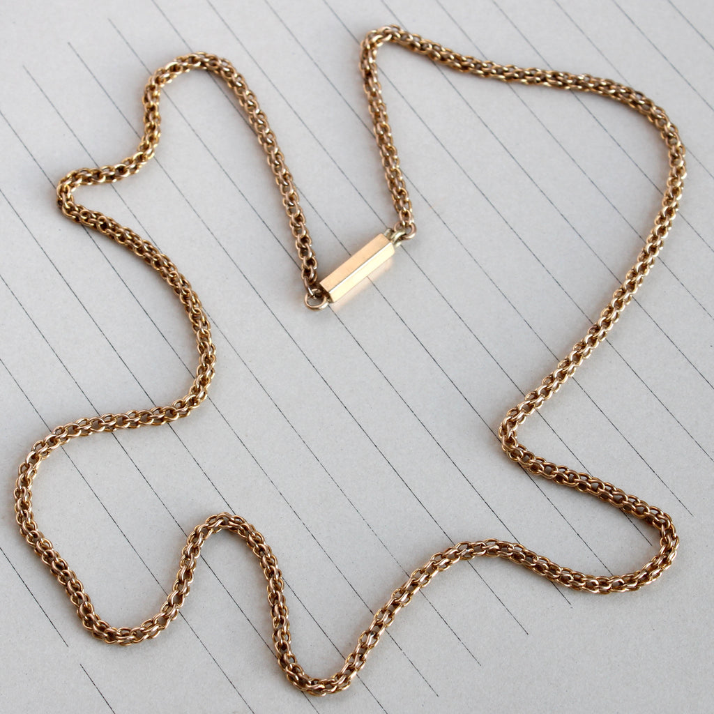 antique wheat link chain in 14k honey yellow gold with a barrel tube clasp