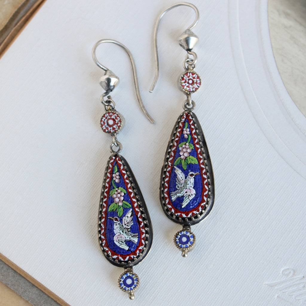 silver micro mosaic drop earrings with doves flying against a royal blue backround, grapes and stars