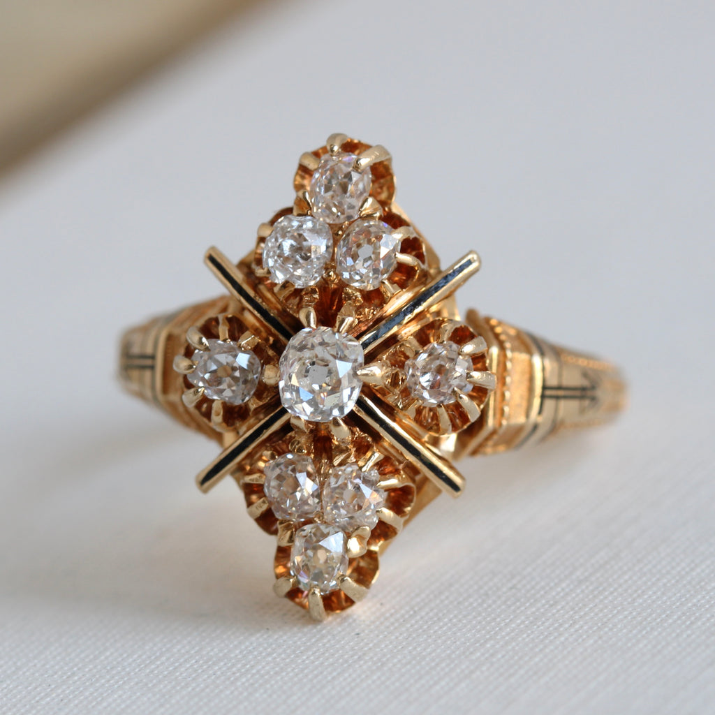yellow gold ring with a cluster design of old mine cut diamonds