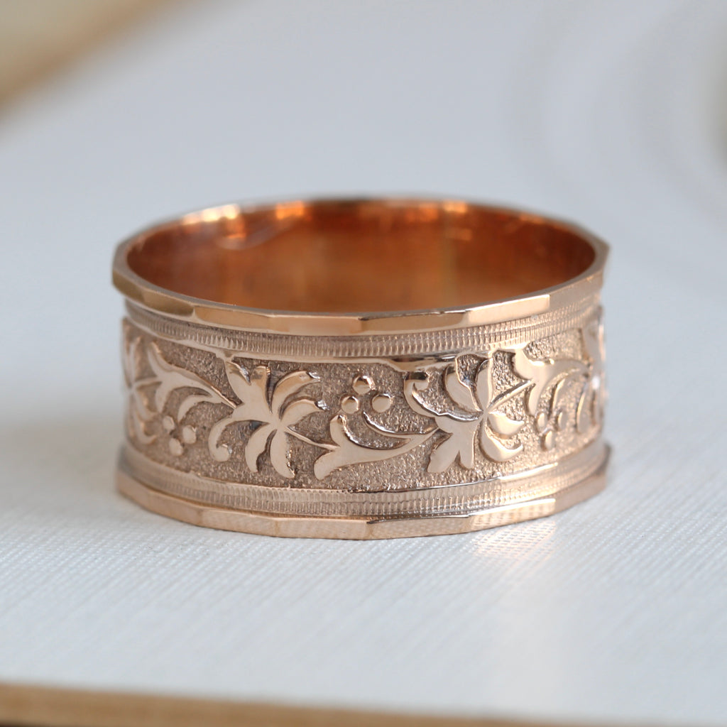 wide rose gold wide with floral decoration chased around the outside
