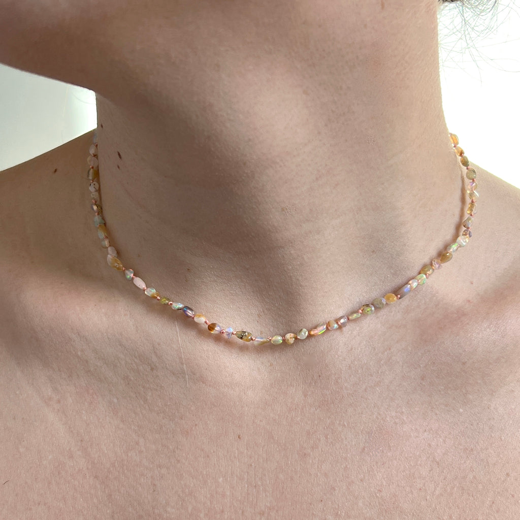 small irregular shaped polished ethiopian opal bead necklace with gold clasp 