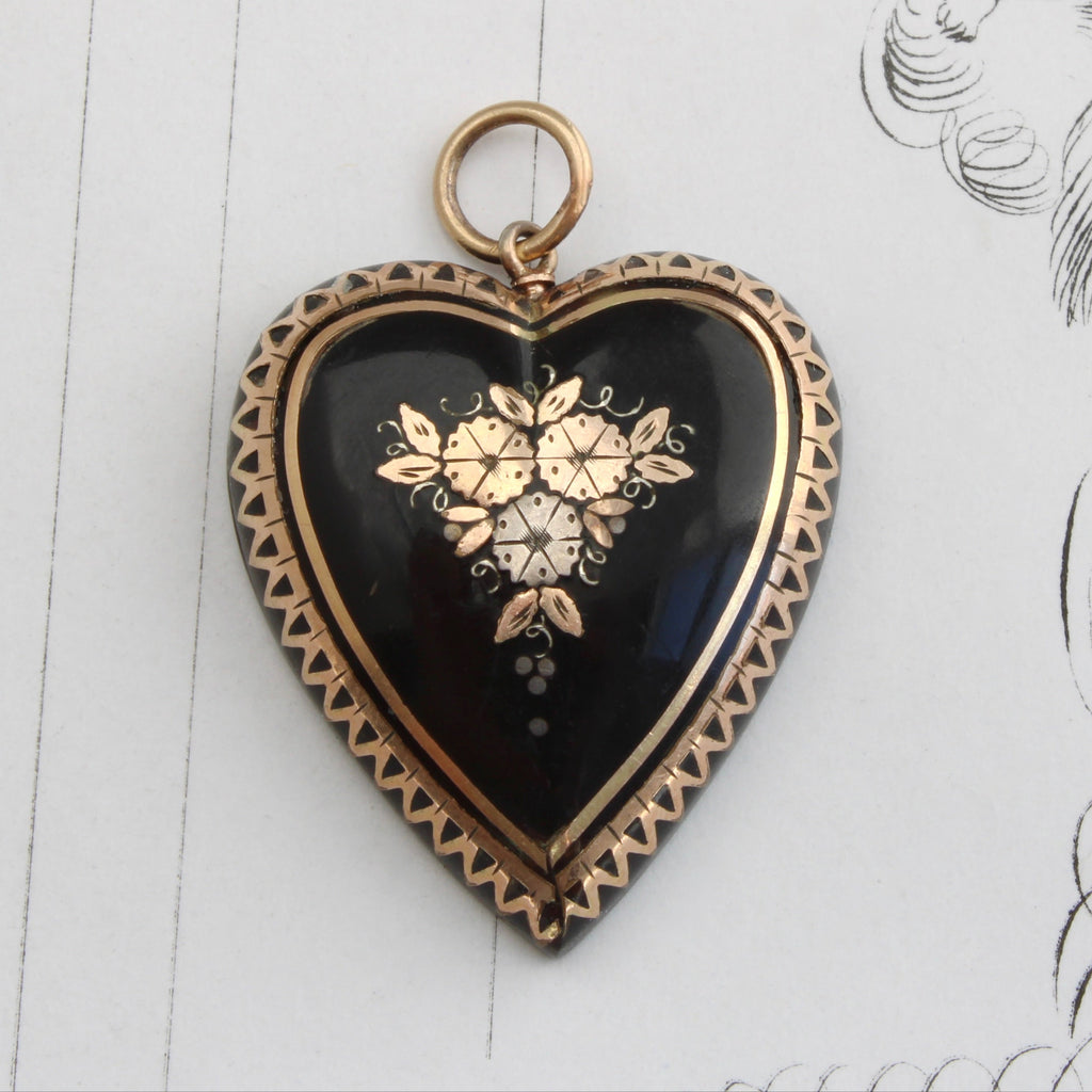 tortoise shell heart pendant inlaid with gold and silver flowers