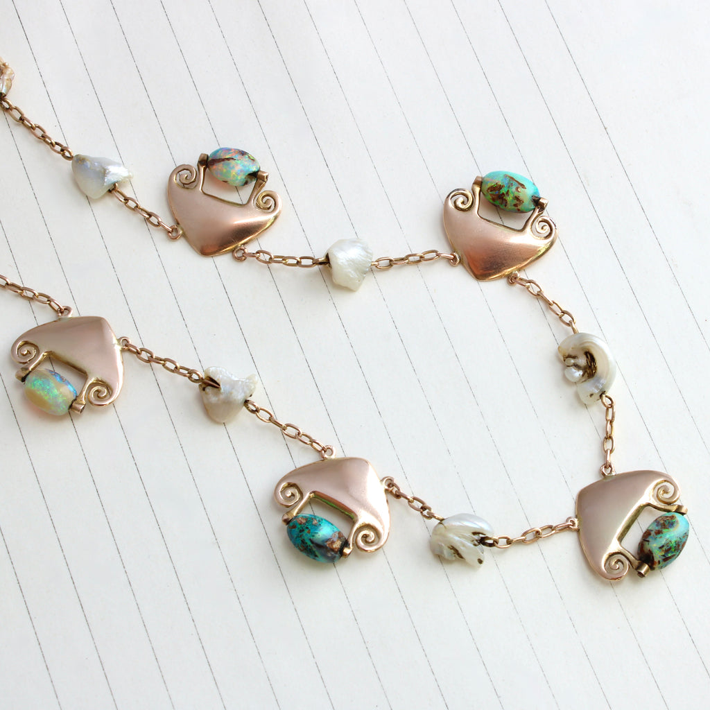 gold art nouveau necklace with five drops ending in colorful boulder opal beads and natural fresh water pearl stations