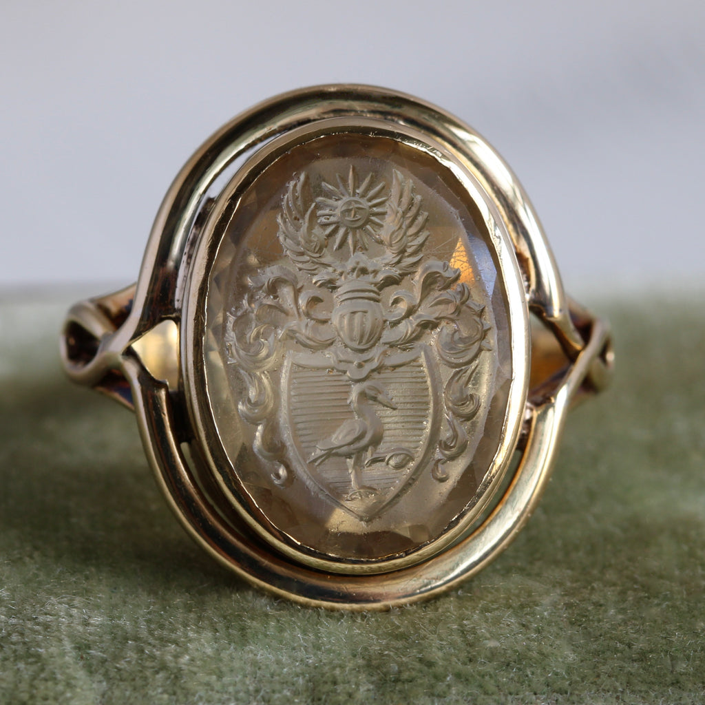 intaglio carved yellow stone with polish noble family coat of arms set in a yellow gold ring mounting