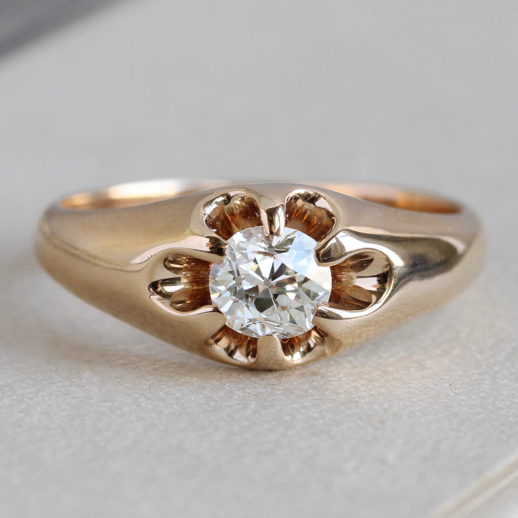 Antique yellow gold ring with a large old mine cut diamond in a multi-prong setting.